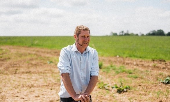 Farmer stood in a field